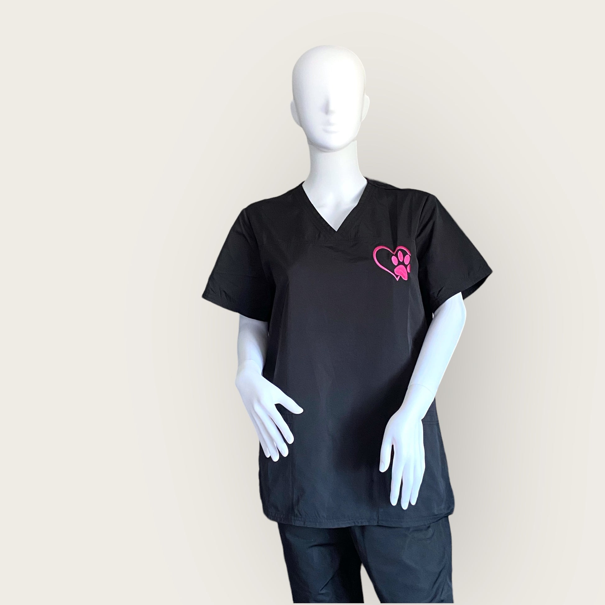 Embroidered V Neck hair resistant tunic in black with pink paw print embroidered logo GroomtecApparel