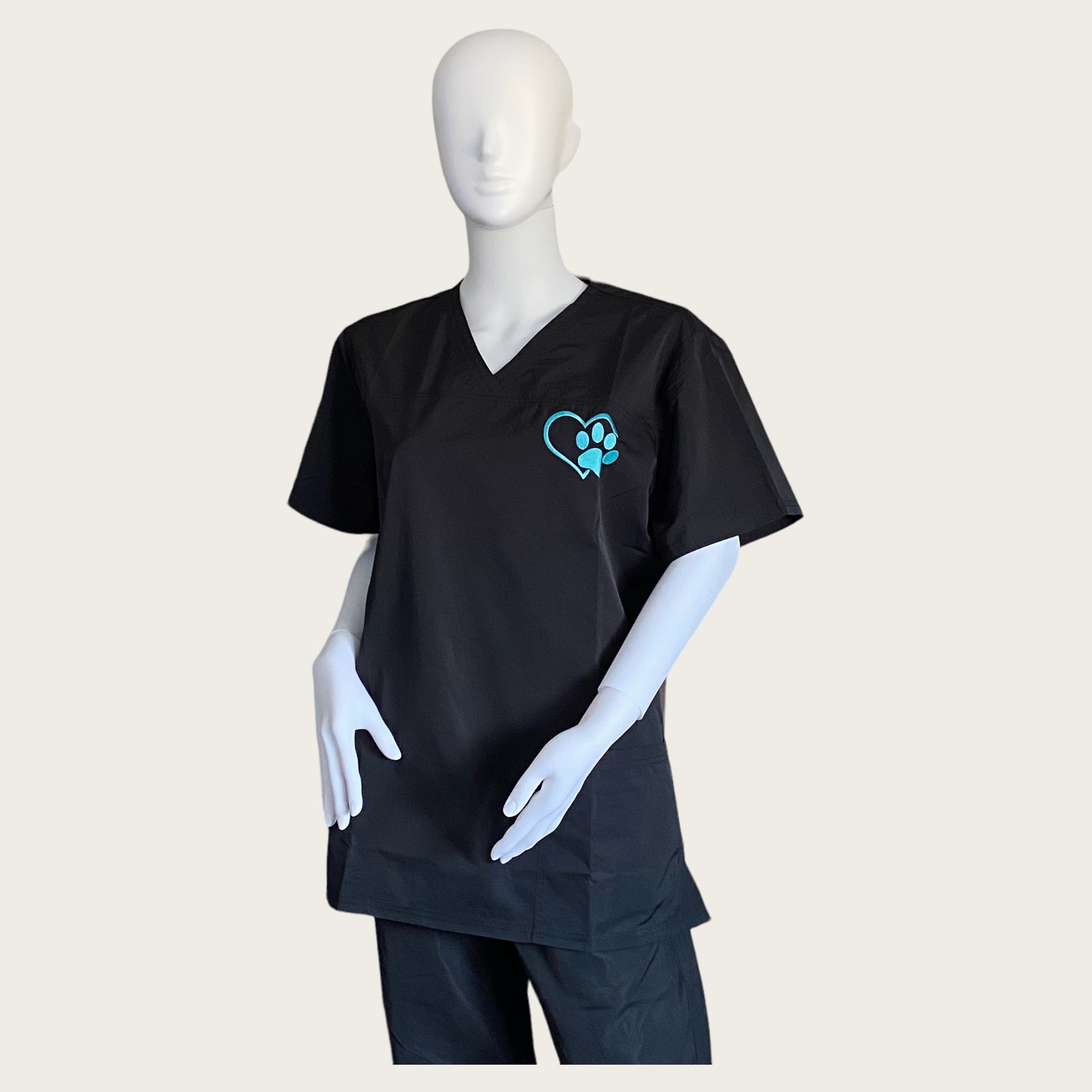 Embroidered V Neck hair resistant Tunic in black with turquoise embroidered paw print logo GroomtecApparel