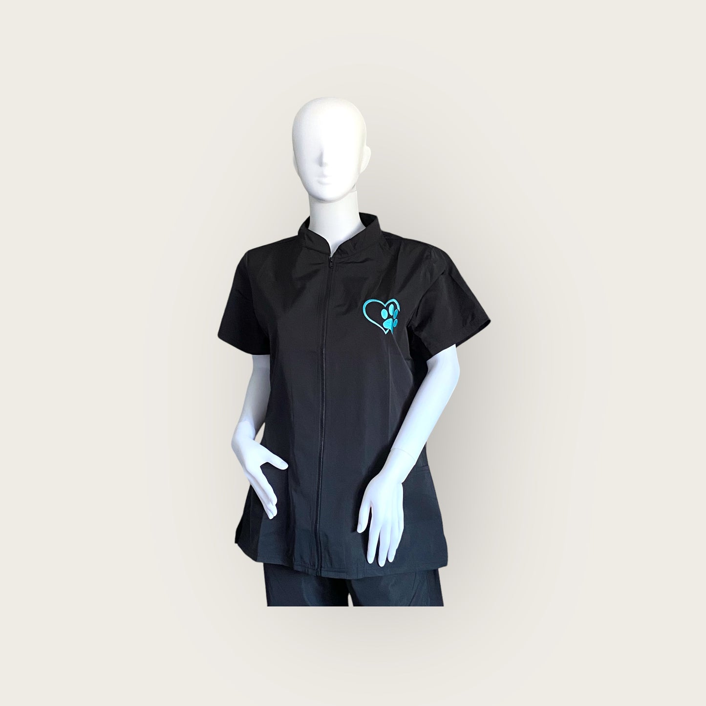 Embroidered Zip Up Hair resistant Grooming Tunic In black with turquoise embroidered paw  print logo- GroomtecApparel